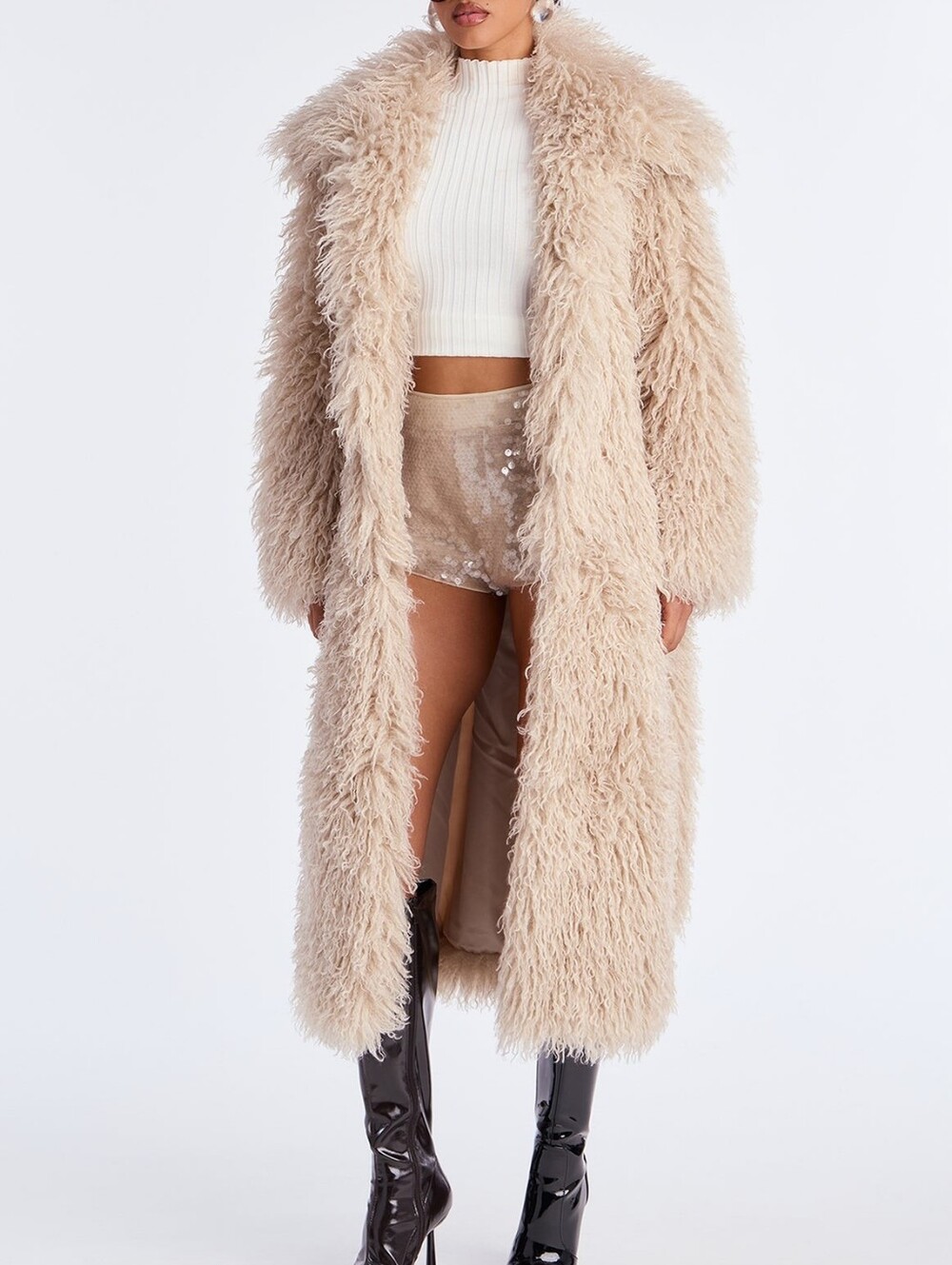 Long women's fur coat made of voluminous beige artificial faux fur